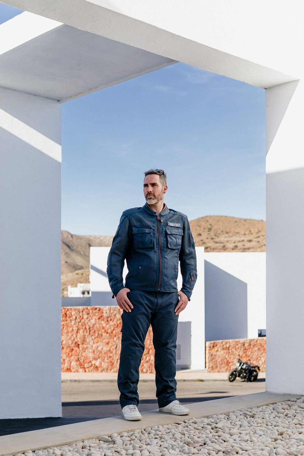 a Motorcycle Rider wearing North of Berlin, desert rider jacket and wingman trousers